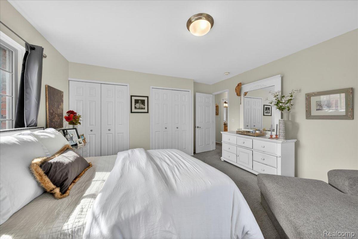 454 Romeo Road, Unit 226 Rochester, MI 48307 - Photo 17 of 26 Carpeted bedroom featuring multiple closets