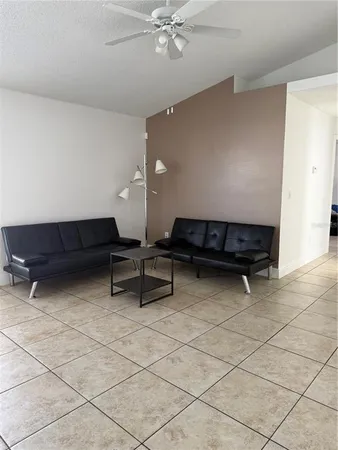 a living room with furniture and a table