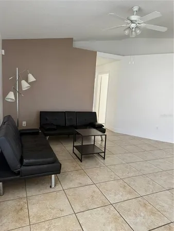 a living room with furniture and a rug