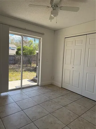 a view of an empty room and a window