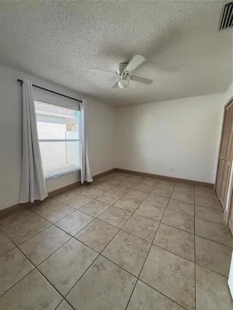 a view of empty room with windows