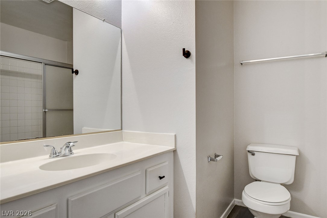 6209 Warm River Road Las Vegas, NV 89108 - Photo 33 of 39 A well-maintained lavatory with a pristine vanity and a convenient shower.