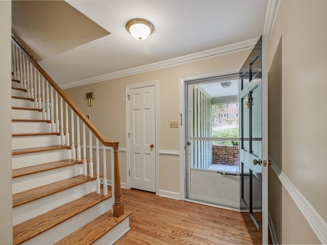 4725 Oak Park Road Raleigh, NC 27612 - Photo 11 of 75 a view of entryway with wooden floor and a livingroom