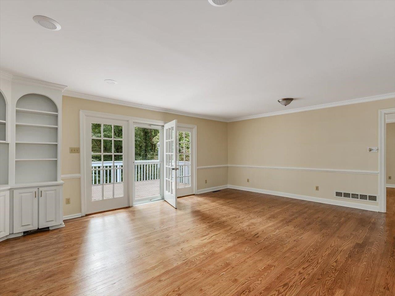 4725 Oak Park Road Raleigh, NC 27612 - Photo 16 of 75 wooden floor in an empty room with a window