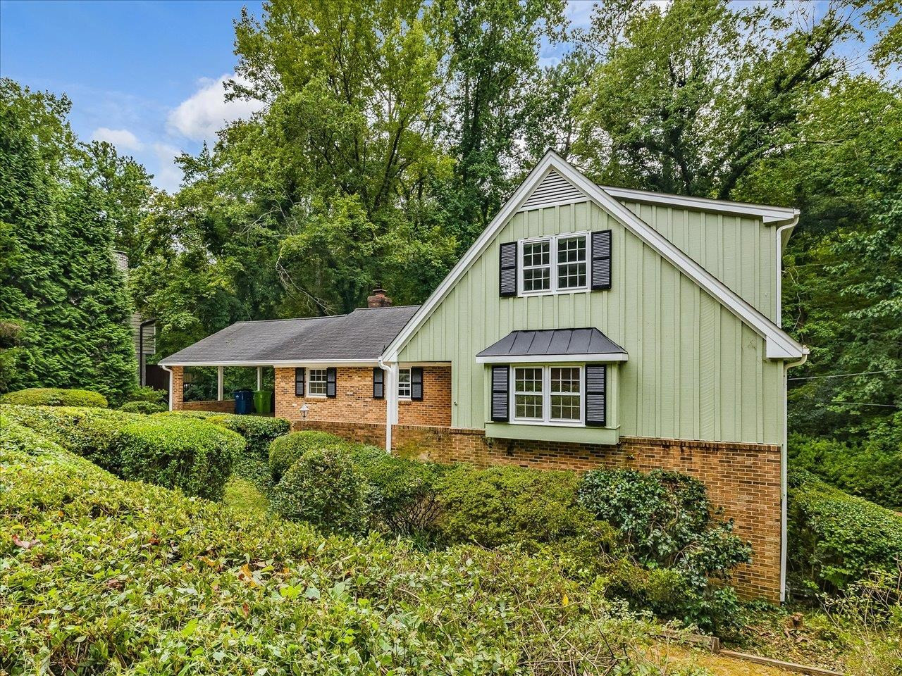 4725 Oak Park Road Raleigh, NC 27612 - Photo 2 of 75 a front view of a house with a yard and trees