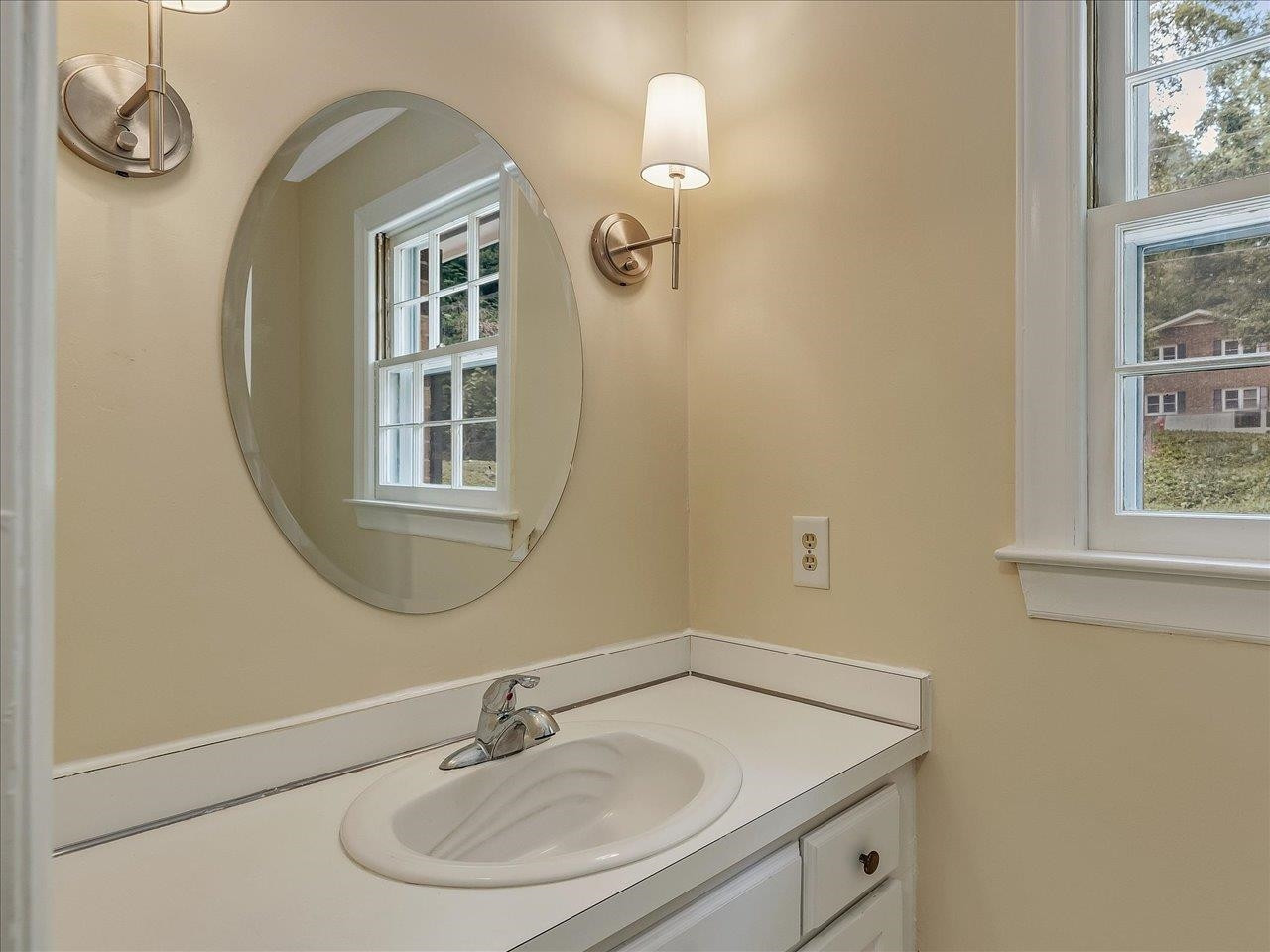 4725 Oak Park Road Raleigh, NC 27612 - Photo 28 of 75 a bathroom with a sink and a mirror