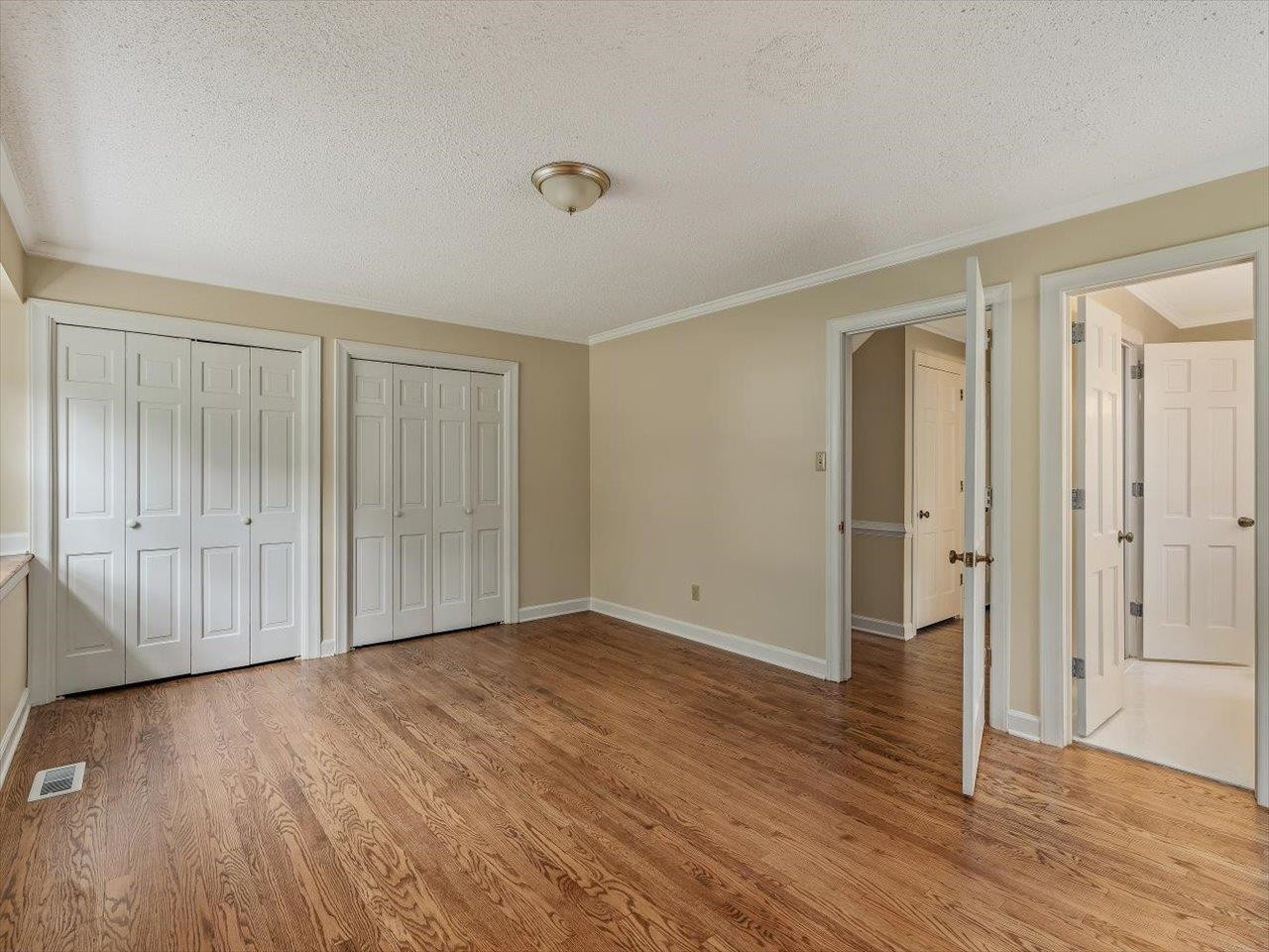 4725 Oak Park Road Raleigh, NC 27612 - Photo 31 of 75 a view of an empty room with wooden floor and a window