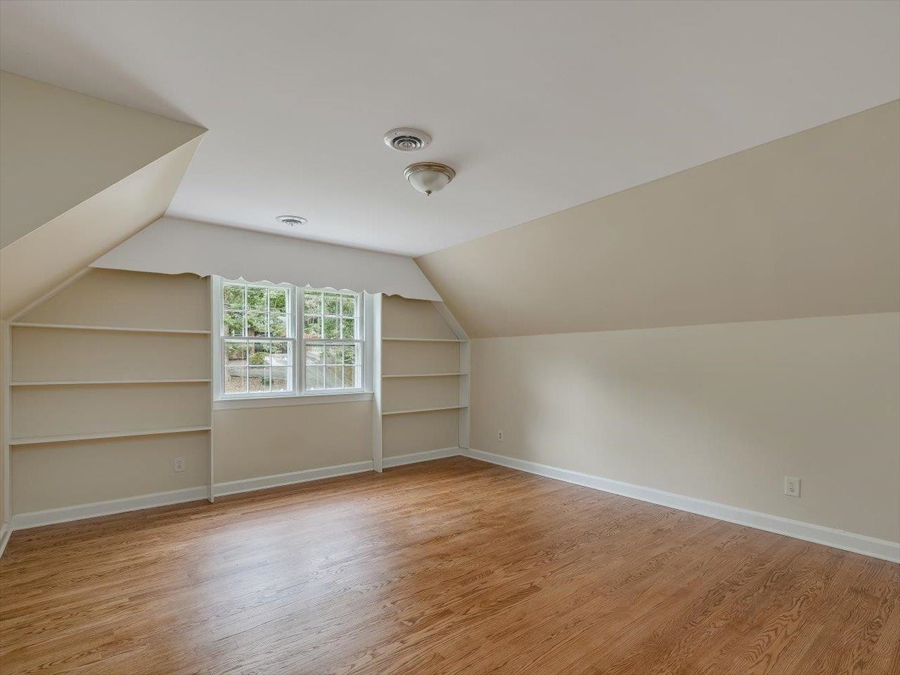 4725 Oak Park Road Raleigh, NC 27612 - Photo 38 of 75 wooden floor in an empty room with a window