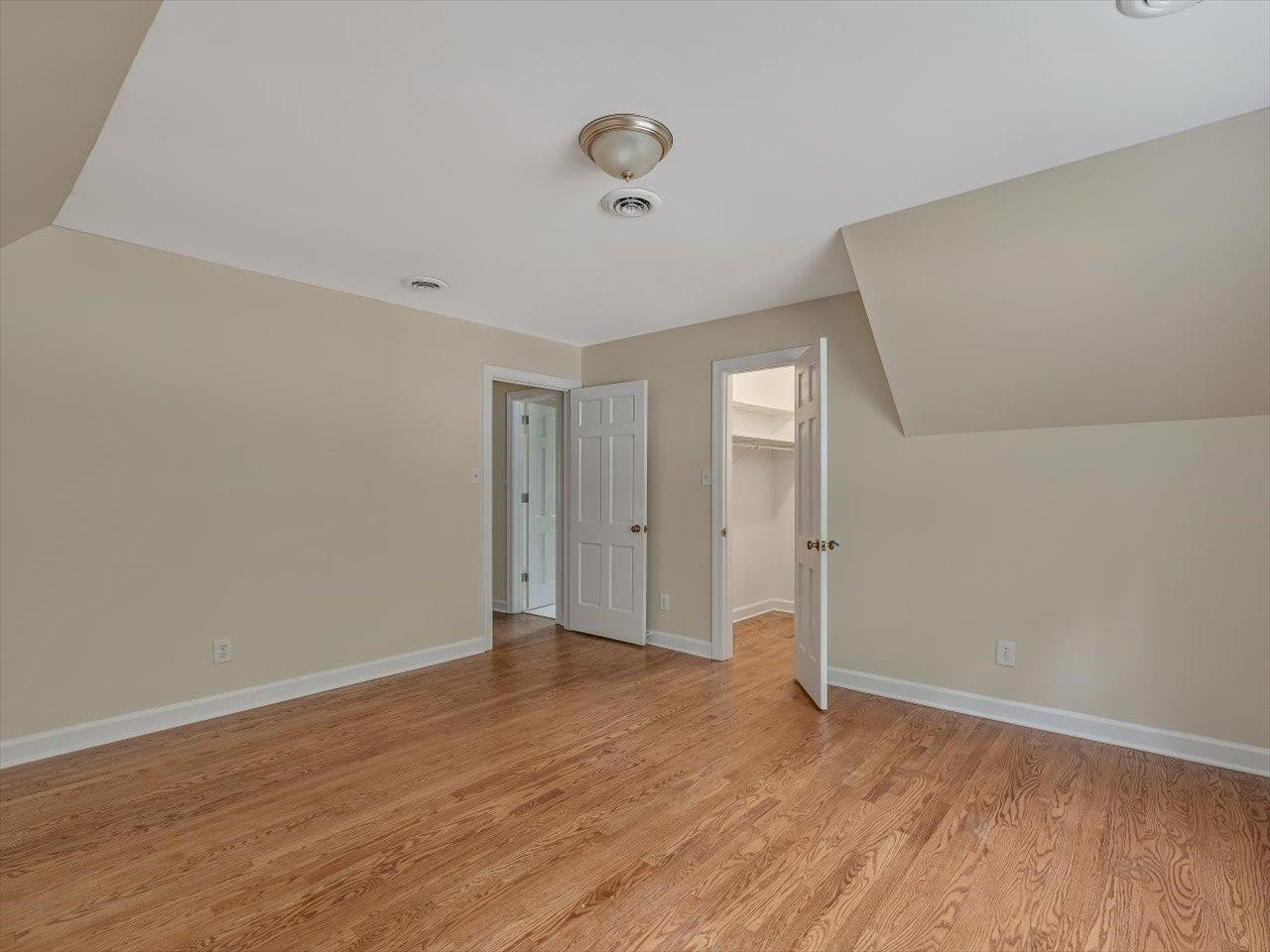 4725 Oak Park Road Raleigh, NC 27612 - Photo 39 of 75 a view of an empty room with wooden floor and a window