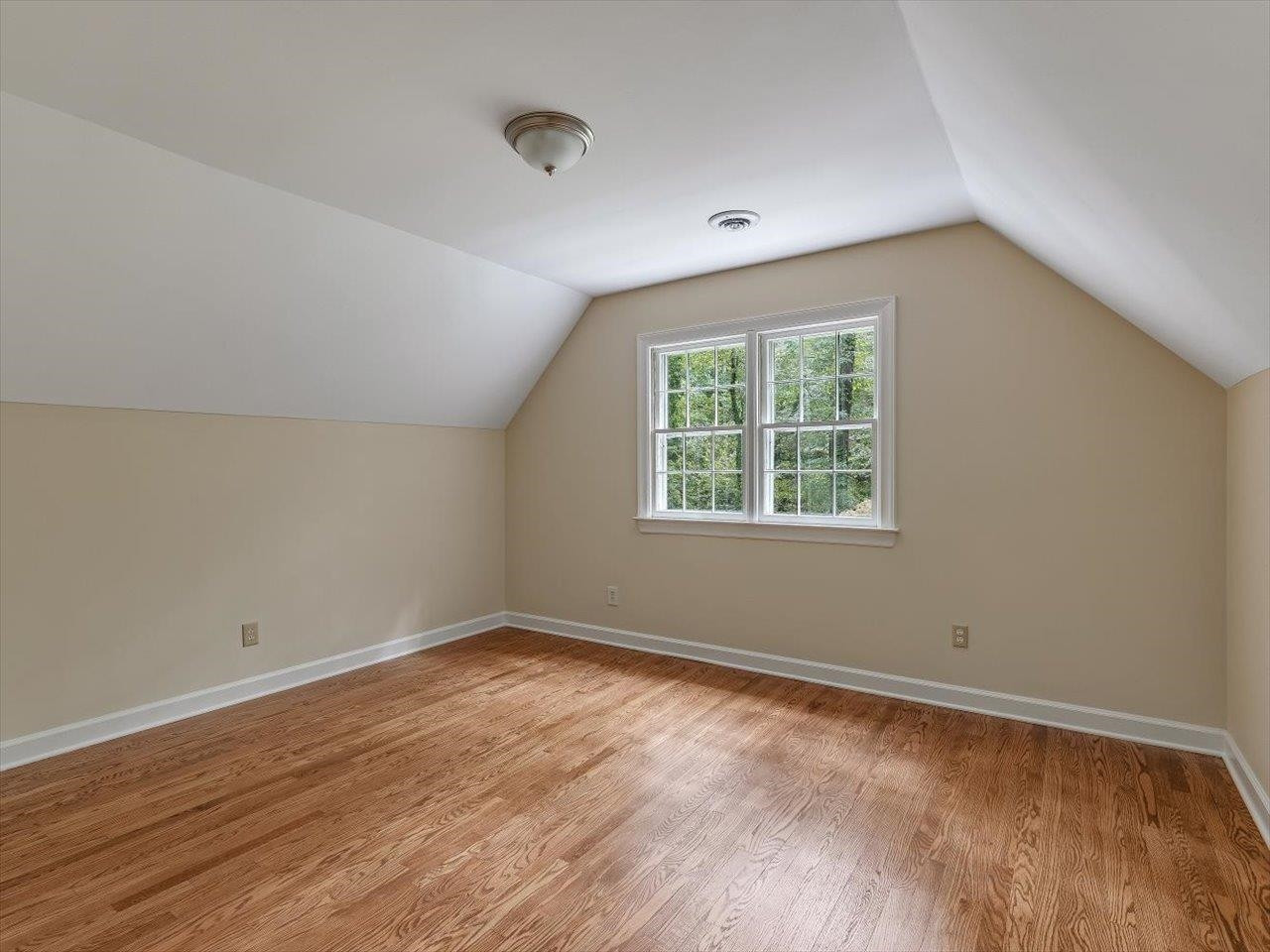 4725 Oak Park Road Raleigh, NC 27612 - Photo 43 of 75 an empty room with wooden floor and windows