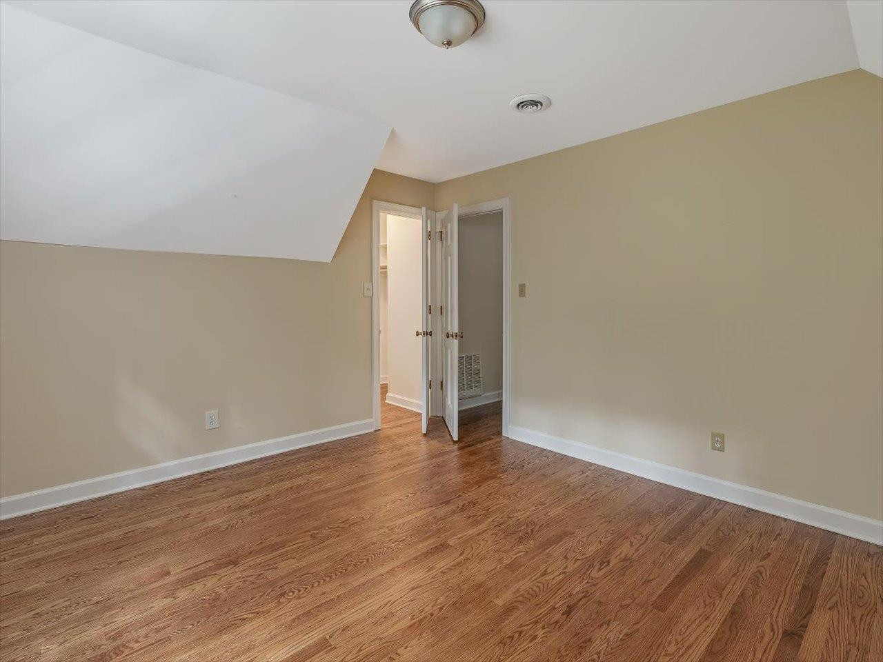 4725 Oak Park Road Raleigh, NC 27612 - Photo 44 of 75 a view of an empty room with wooden floor and window