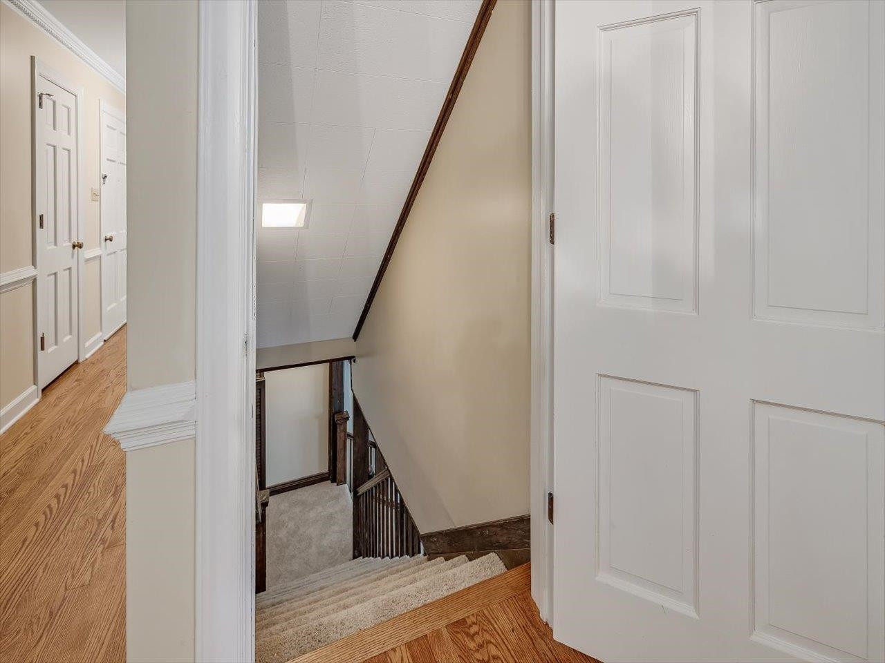 4725 Oak Park Road Raleigh, NC 27612 - Photo 46 of 75 a view of a hallway with wooden floor and staircase