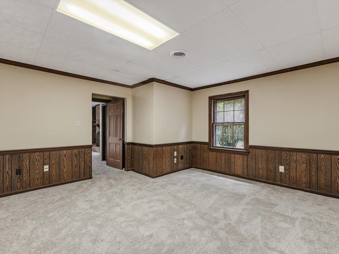 4725 Oak Park Road Raleigh, NC 27612 - Photo 56 of 75 a bedroom with a bed and window