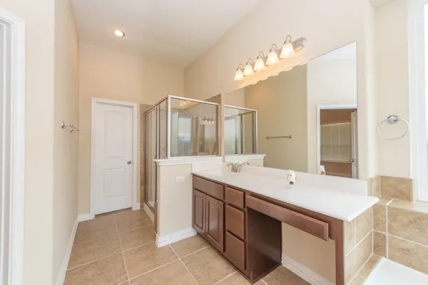 a view of bathroom with a sink and a mirror
