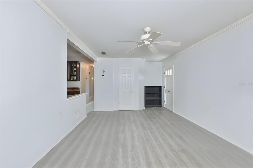 14451 Highland Road Wimauma, FL 33598 - Photo 56 of 80 wooden floor in an empty room with a window