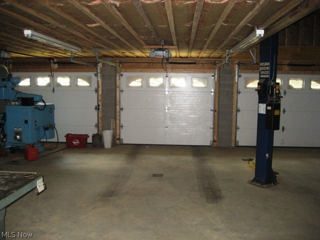 1524 Harmony Road Akron, OH 44333 - Photo 12 of 20 Three car garage addition with car lift and above storage that could be further apartment or in law stuite