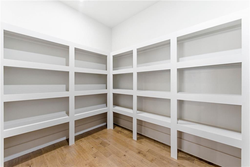 158 Races Road Hoschton, GA 30548 - Photo 12 of 24 a view of an empty room with empty racks