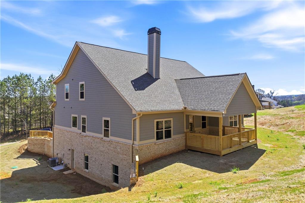 158 Races Road Hoschton, GA 30548 - Photo 4 of 24 a front view of a house with a yard
