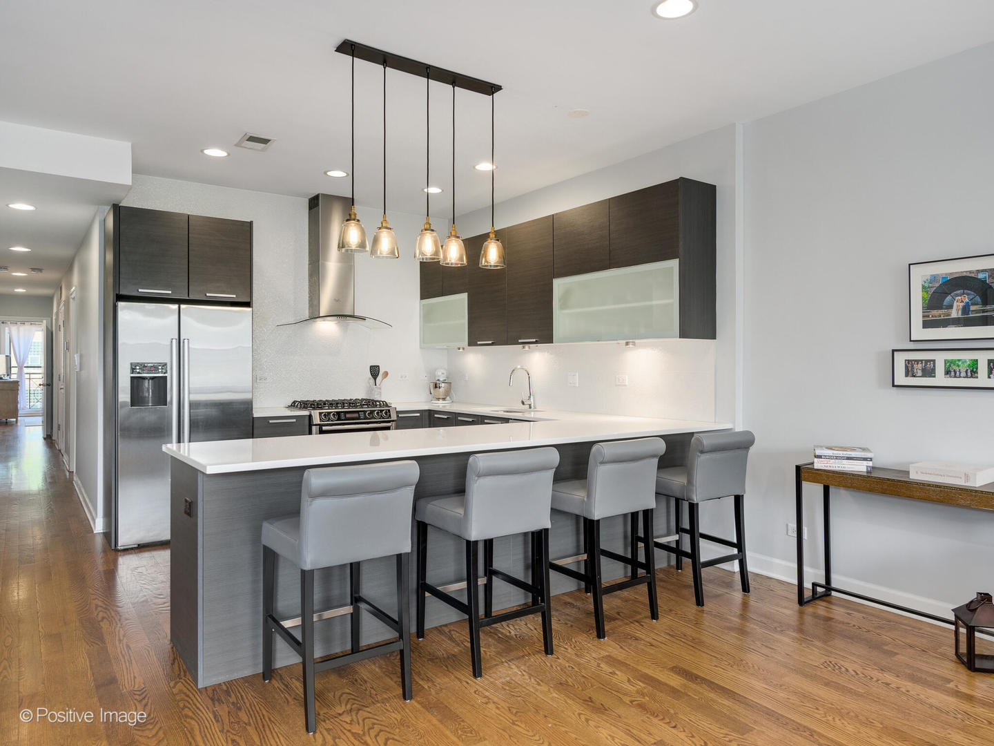 2128 West Rice Street, Unit 3 Chicago, IL 60622 - Photo 11 of 23 a kitchen with a table chairs stove and refrigerator