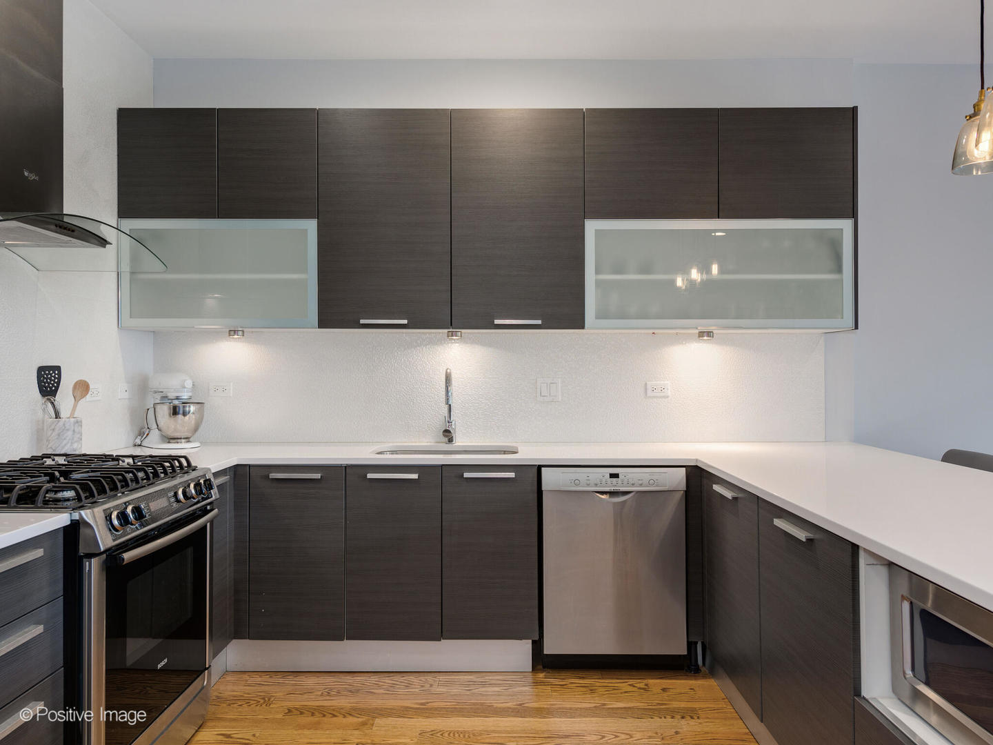 2128 West Rice Street, Unit 3 Chicago, IL 60622 - Photo 13 of 23 a kitchen with a sink and a stove
