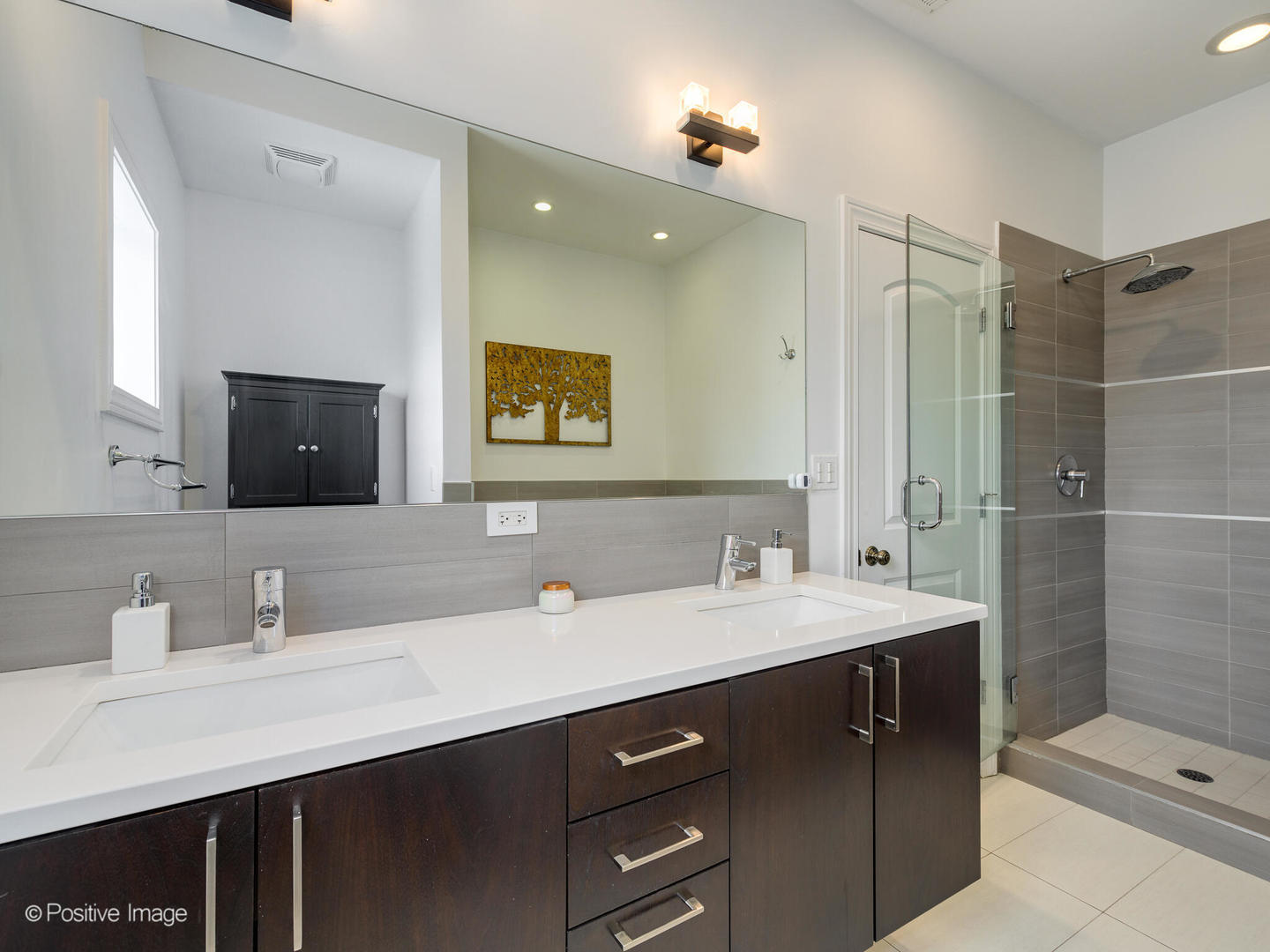 2128 West Rice Street, Unit 3 Chicago, IL 60622 - Photo 18 of 23 a bathroom with a double vanity sink mirror and shower