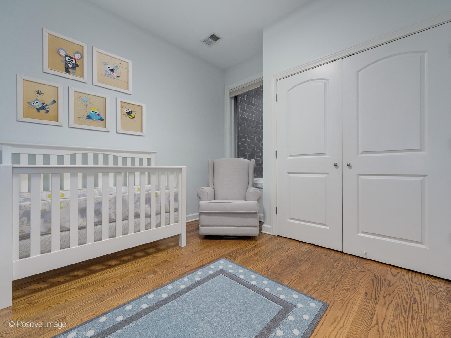 2128 West Rice Street, Unit 3 Chicago, IL 60622 - Photo 21 of 23 a living room with furniture and a rug