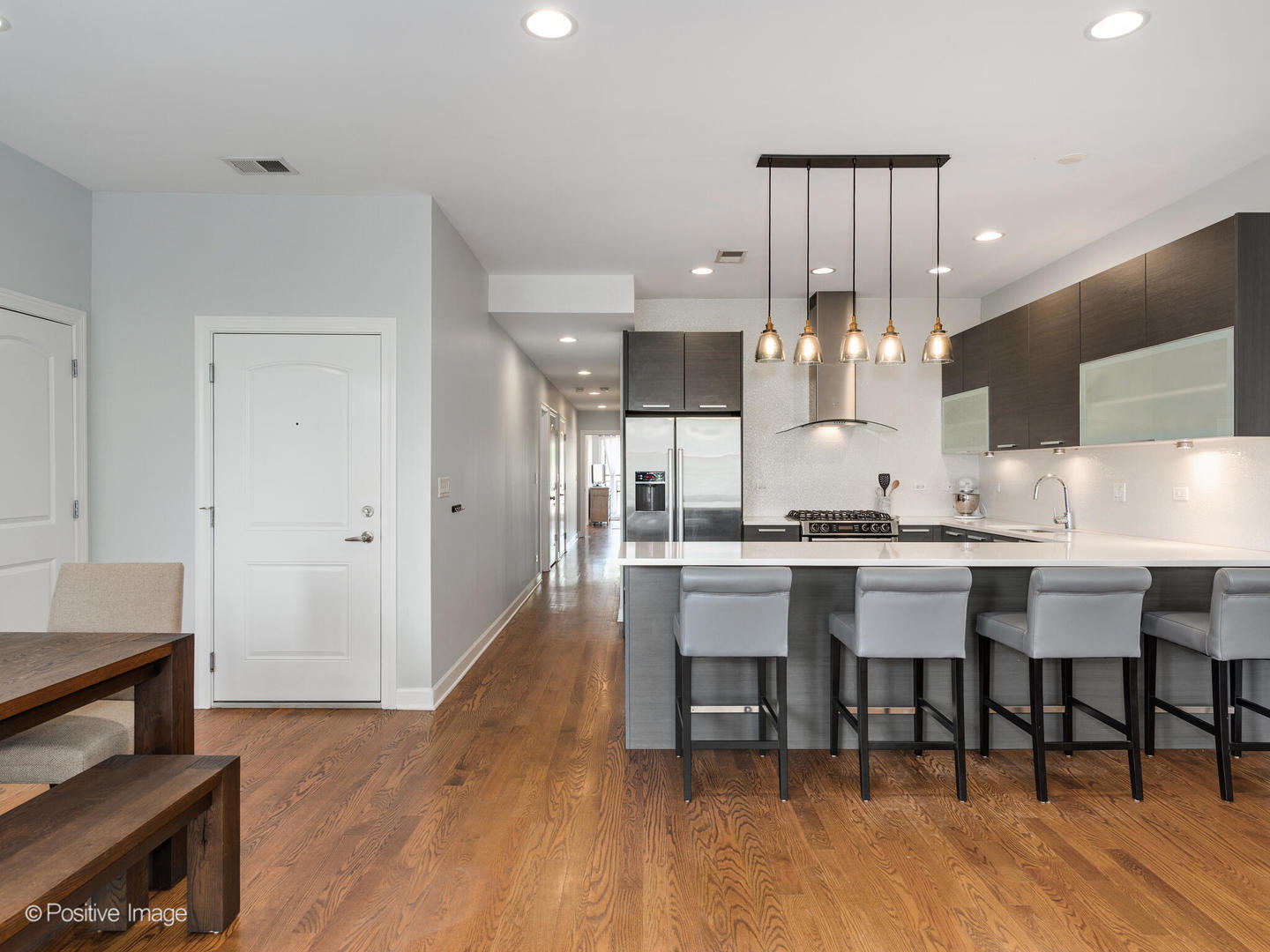 2128 West Rice Street, Unit 3 Chicago, IL 60622 - Photo 10 of 23 a large kitchen with a table and chairs