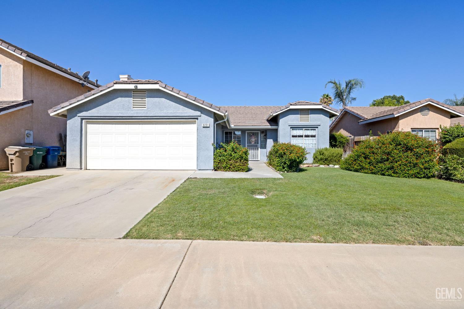 Undisclosed Address Bakersfield, CA 93312 - Photo 1 of 40 a front view of a house with a yard
