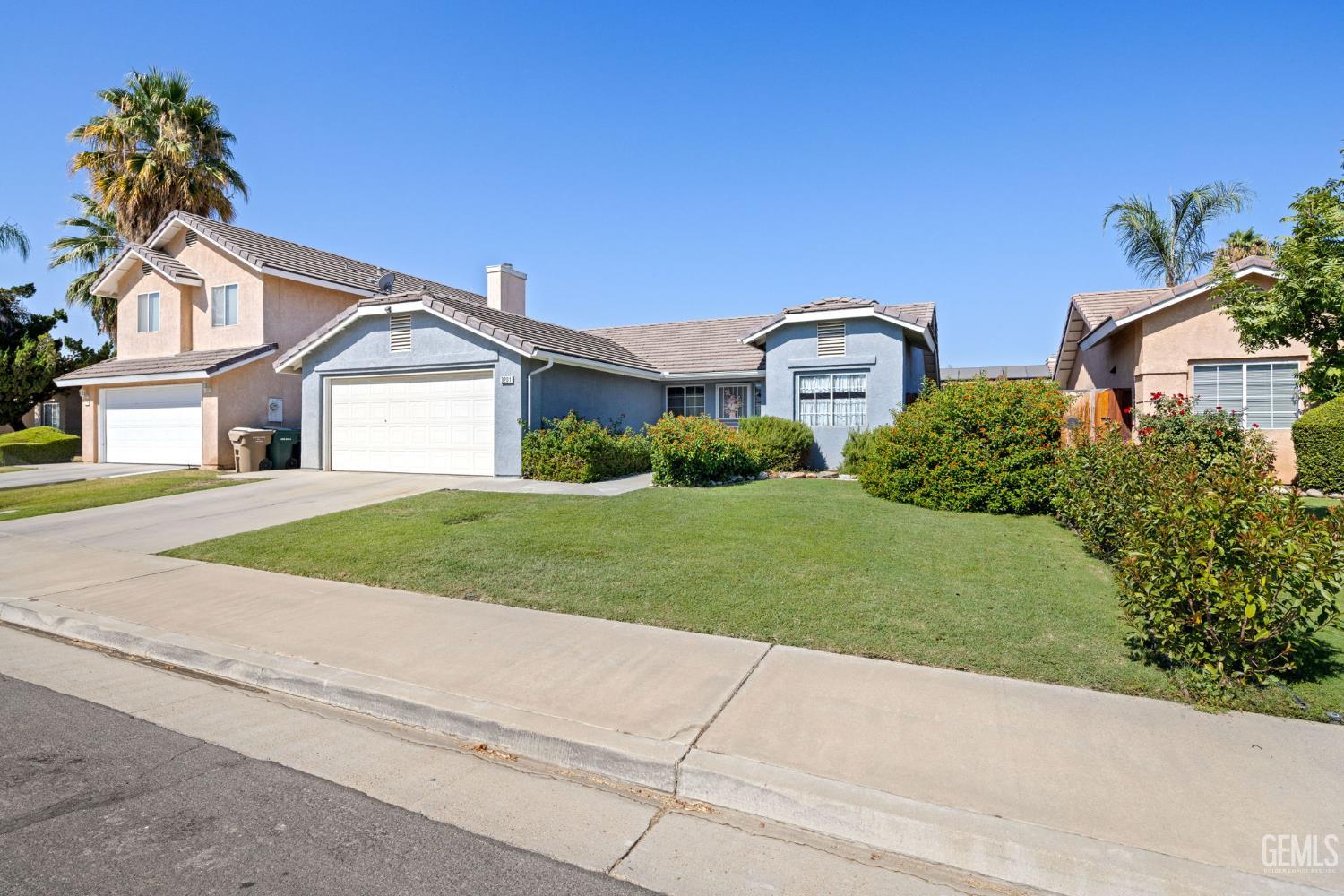 Undisclosed Address Bakersfield, CA 93312 - Photo 3 of 40 a front view of a house with a yard