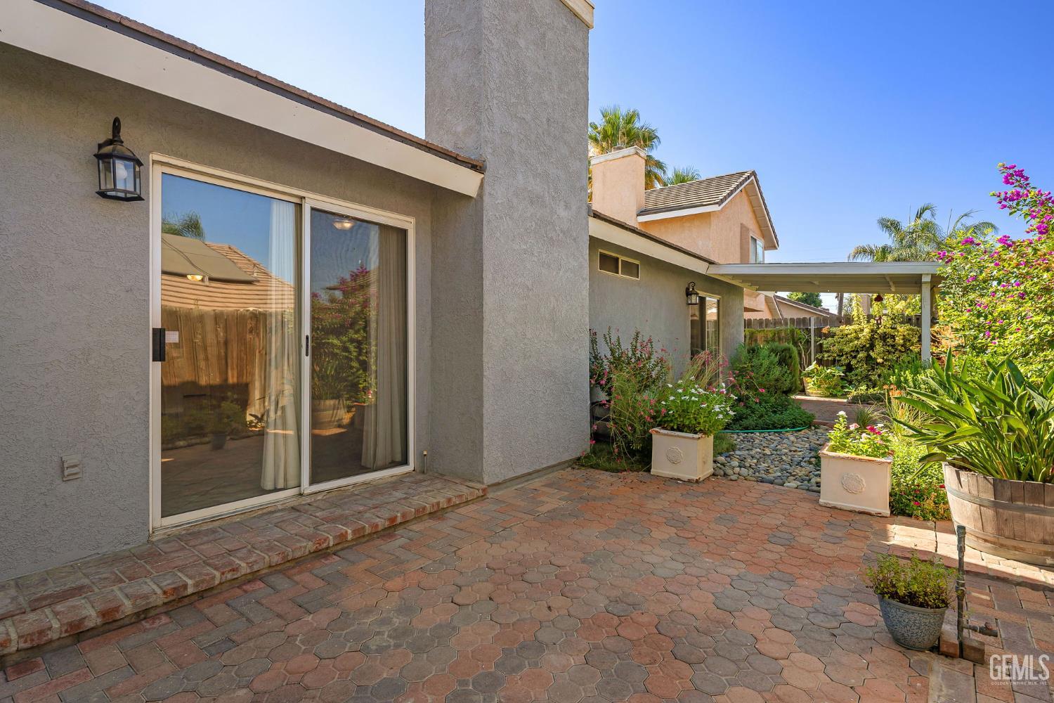 Undisclosed Address Bakersfield, CA 93312 - Photo 36 of 40 a view of a house with porch and garden
