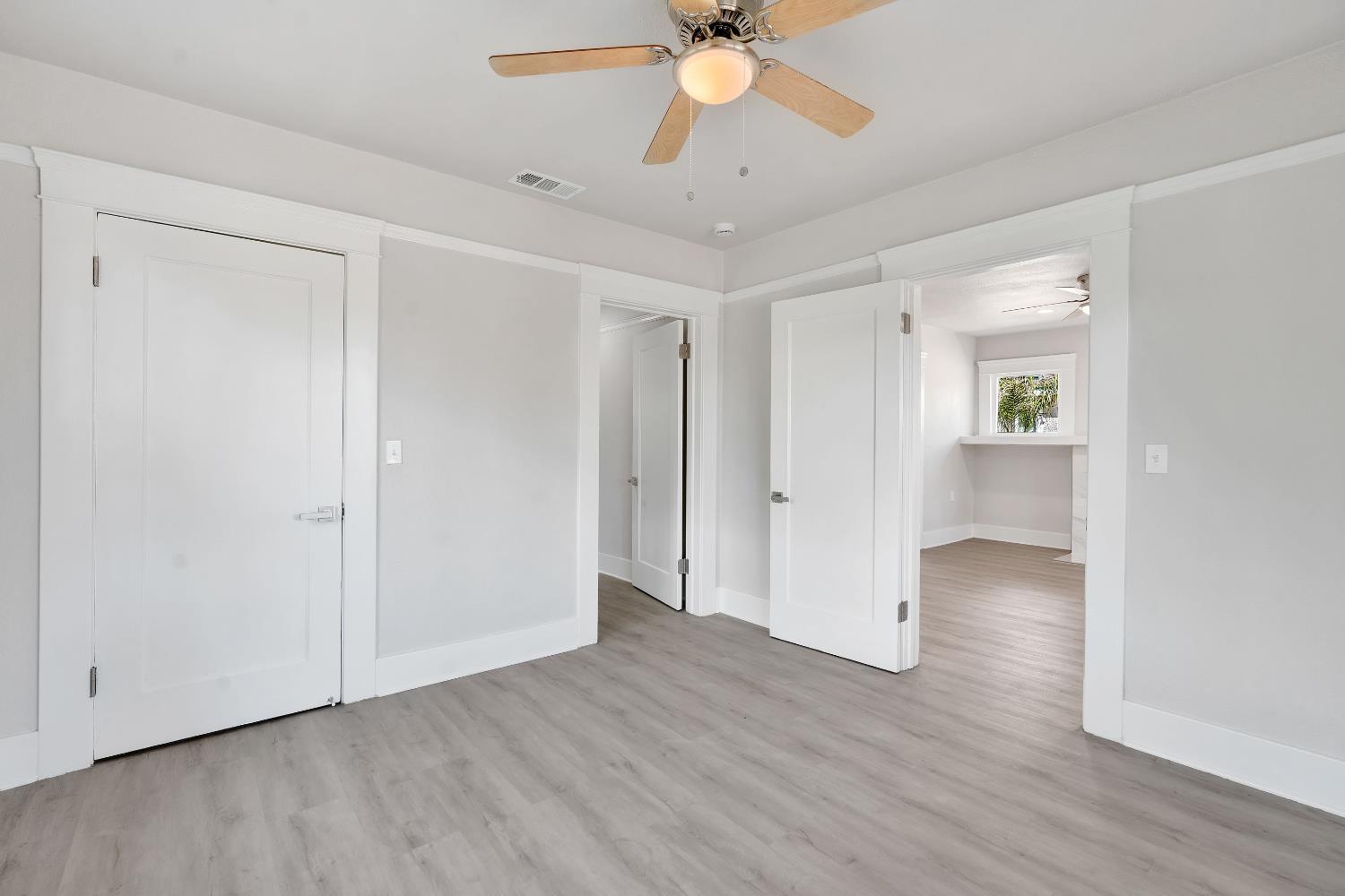 3935 East Balch Avenue Fresno, CA 93702 - Photo 19 of 25 wooden floor in an empty room with a window