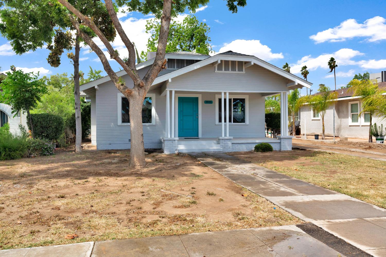3935 East Balch Avenue Fresno, CA 93702 - Photo 2 of 25 a front view of a house with a yard