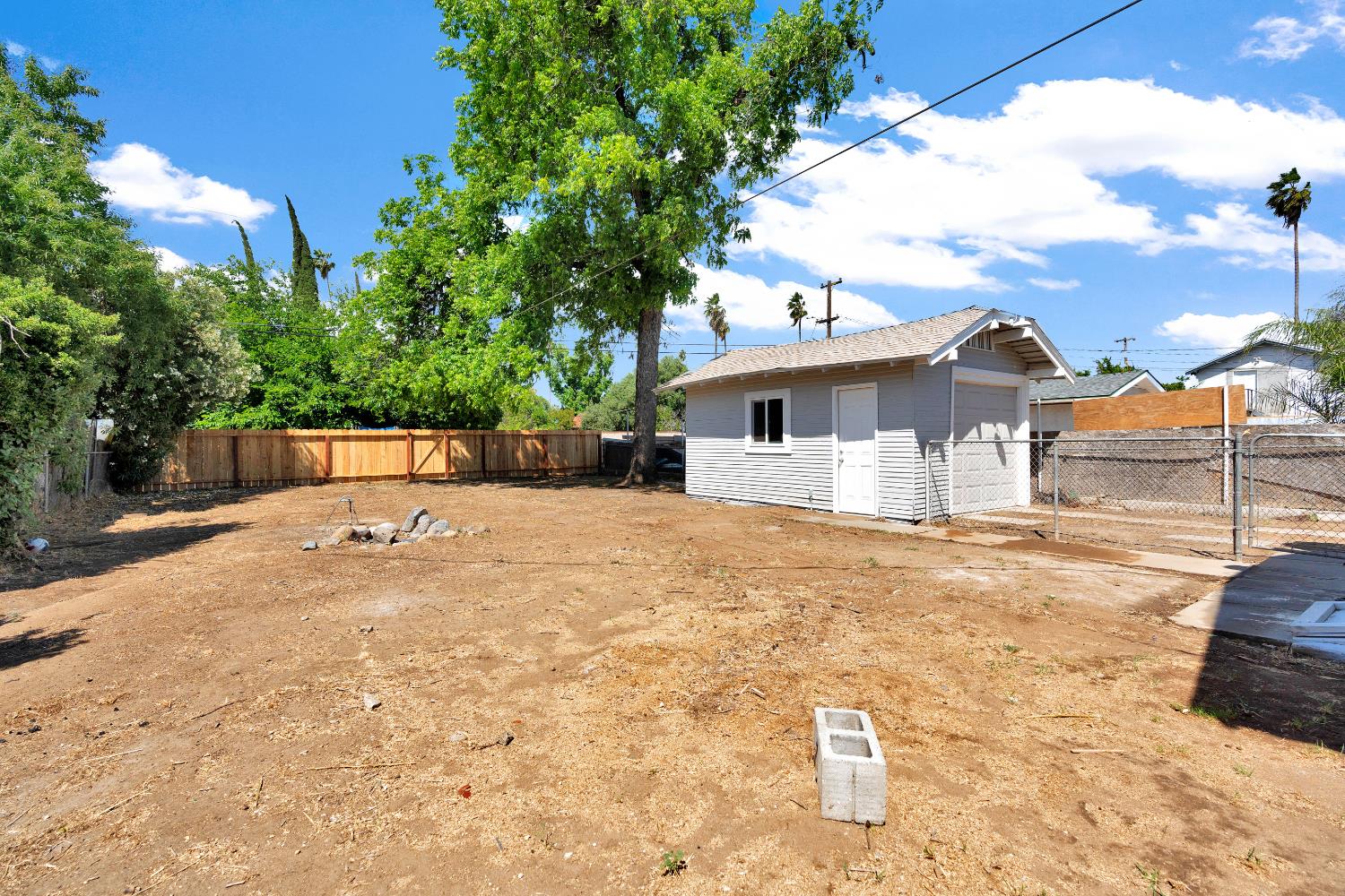3935 East Balch Avenue Fresno, CA 93702 - Photo 25 of 25 a view of a house with a yard and garage