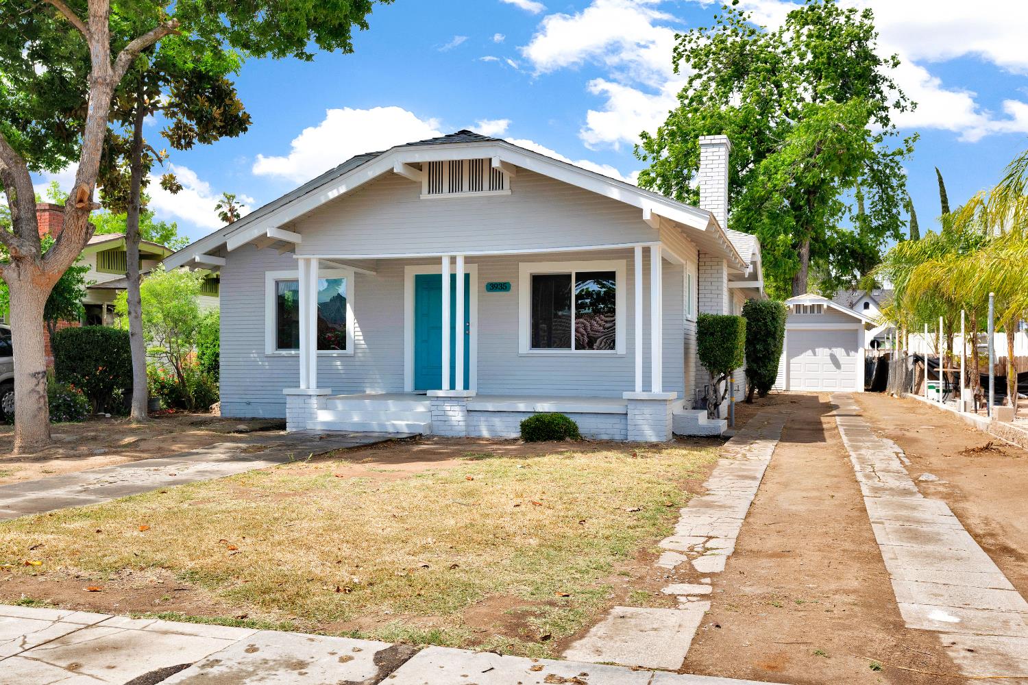 3935 East Balch Avenue Fresno, CA 93702 - Photo 3 of 25 a front view of a house with a yard