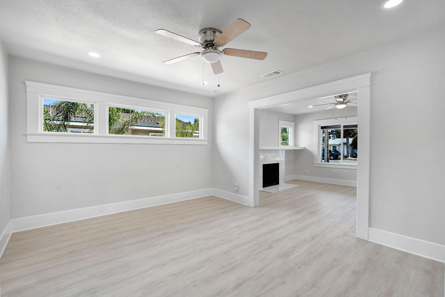 3935 East Balch Avenue Fresno, CA 93702 - Photo 10 of 25 wooden floor in an empty room with a window