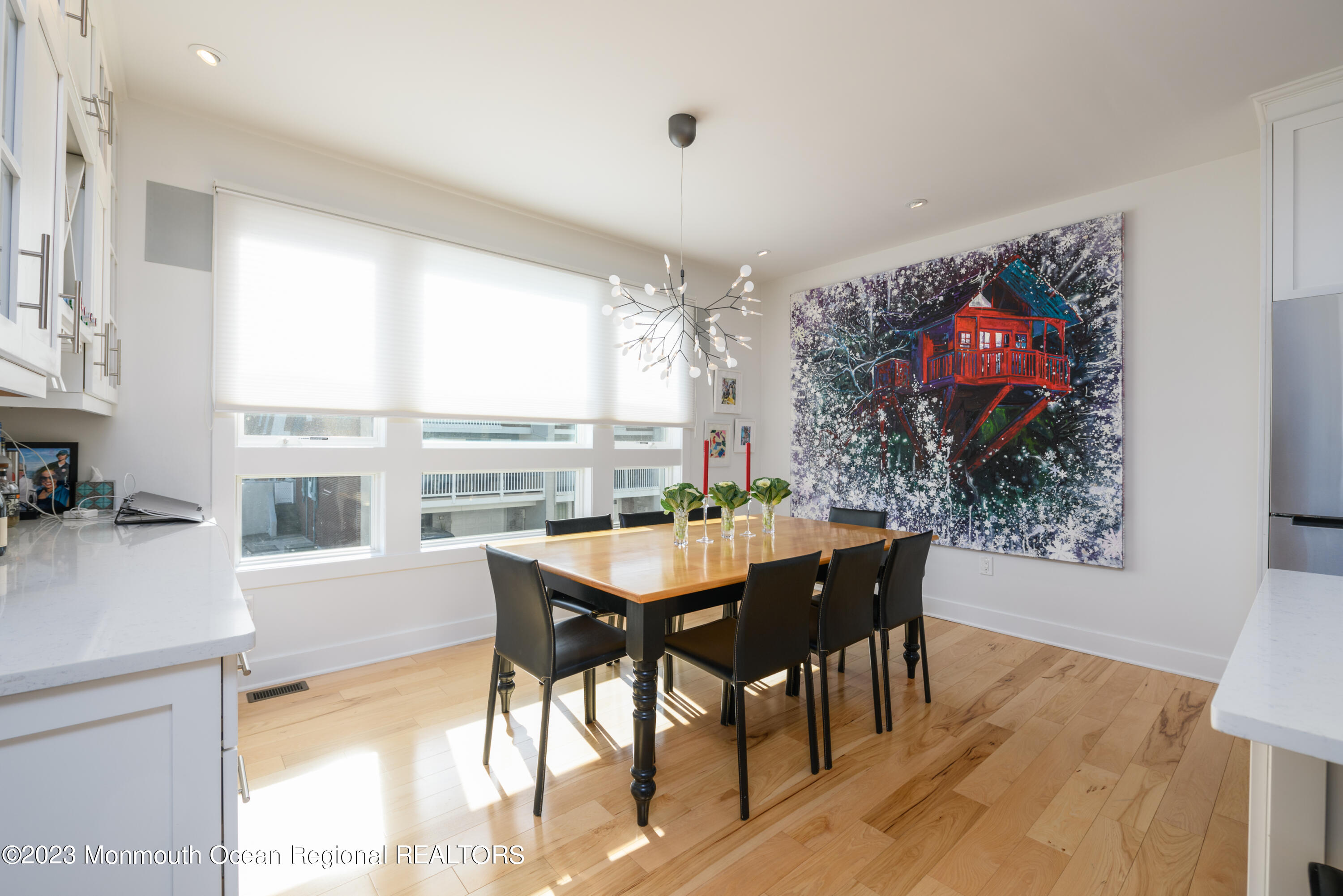 25 Village Road Sea Bright, NJ 07760 - Photo 25 of 37 a view of a dining room with furniture large window and wooden floor