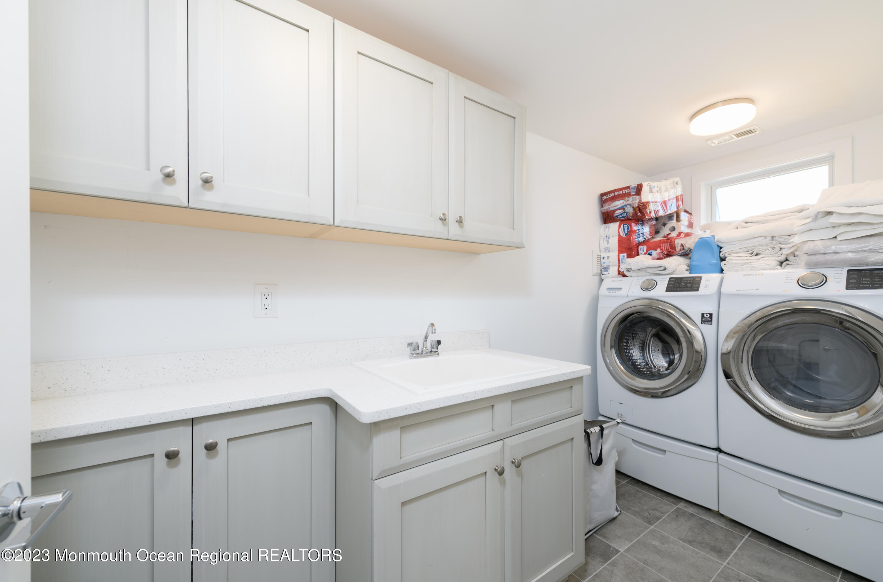 25 Village Road Sea Bright, NJ 07760 - Photo 33 of 37 a utility room with sink dryer and washer