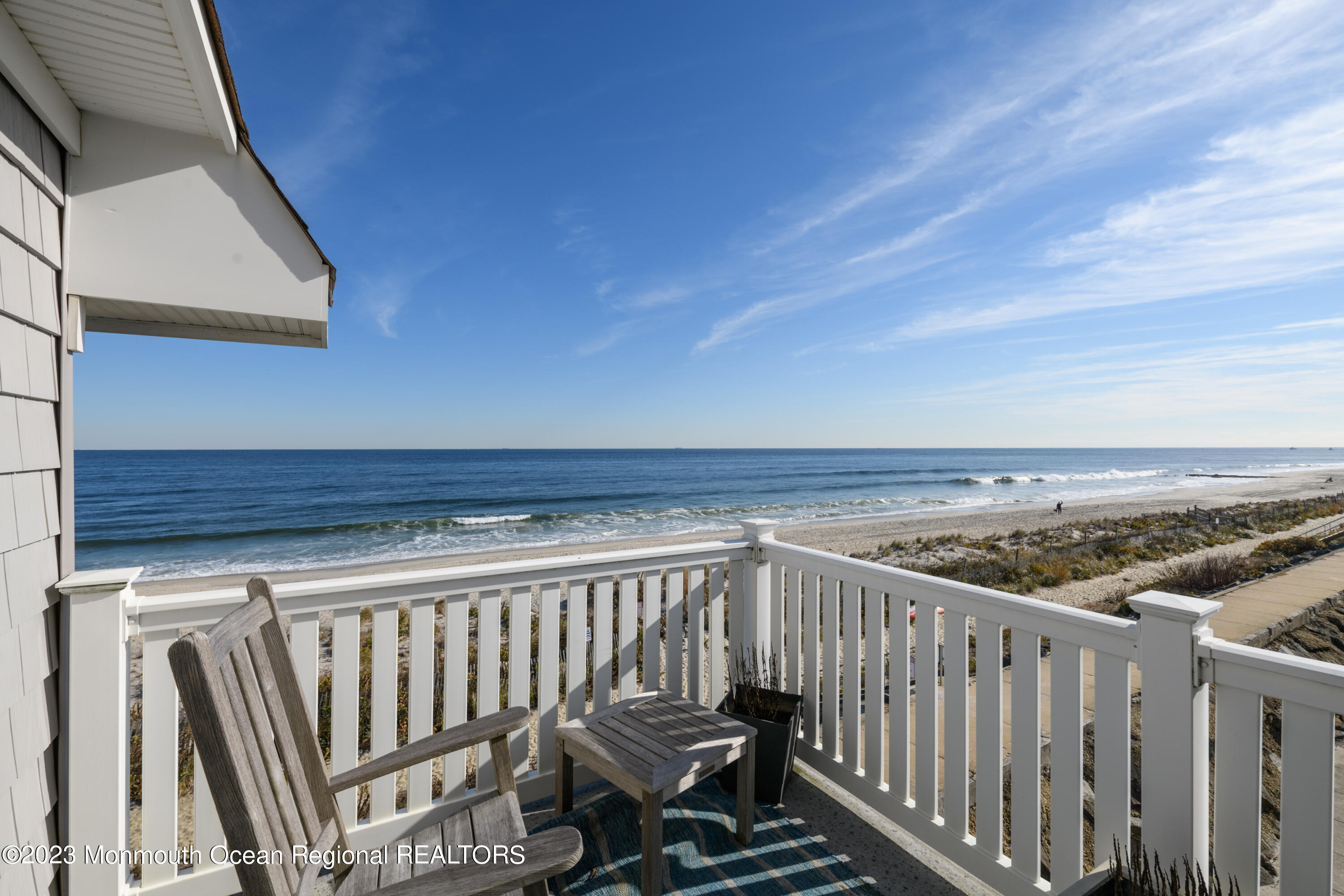 25 Village Road Sea Bright, NJ 07760 - Photo 35 of 37 a view of a roof deck with wooden floor and fence