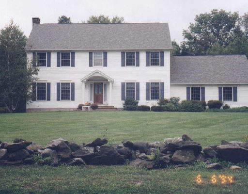 6 Dingle Brook Road Brookfield, CT 06804 - Photo 1 of 1 a front view of a house with a garden and trees