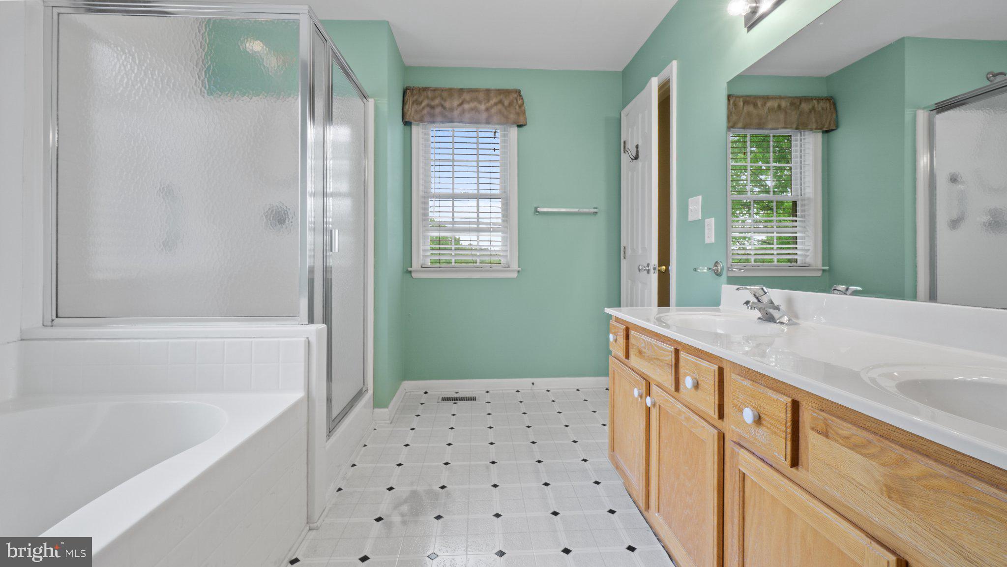 404 Michigan Drive Falling Waters, WV 25419 - Photo 13 of 28 Serene bathroom with fresh colors.