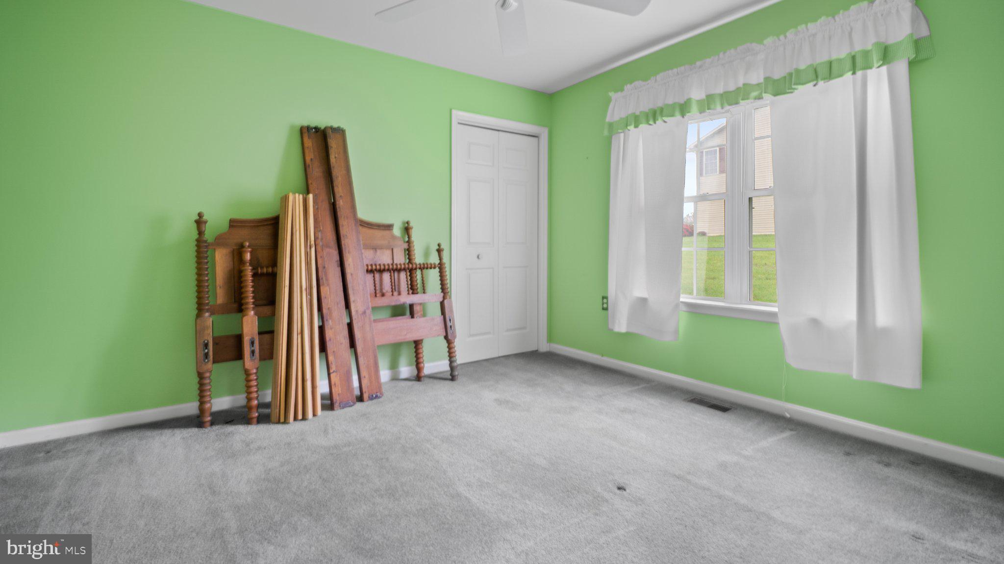 404 Michigan Drive Falling Waters, WV 25419 - Photo 17 of 28 Vibrant green room with natural light.