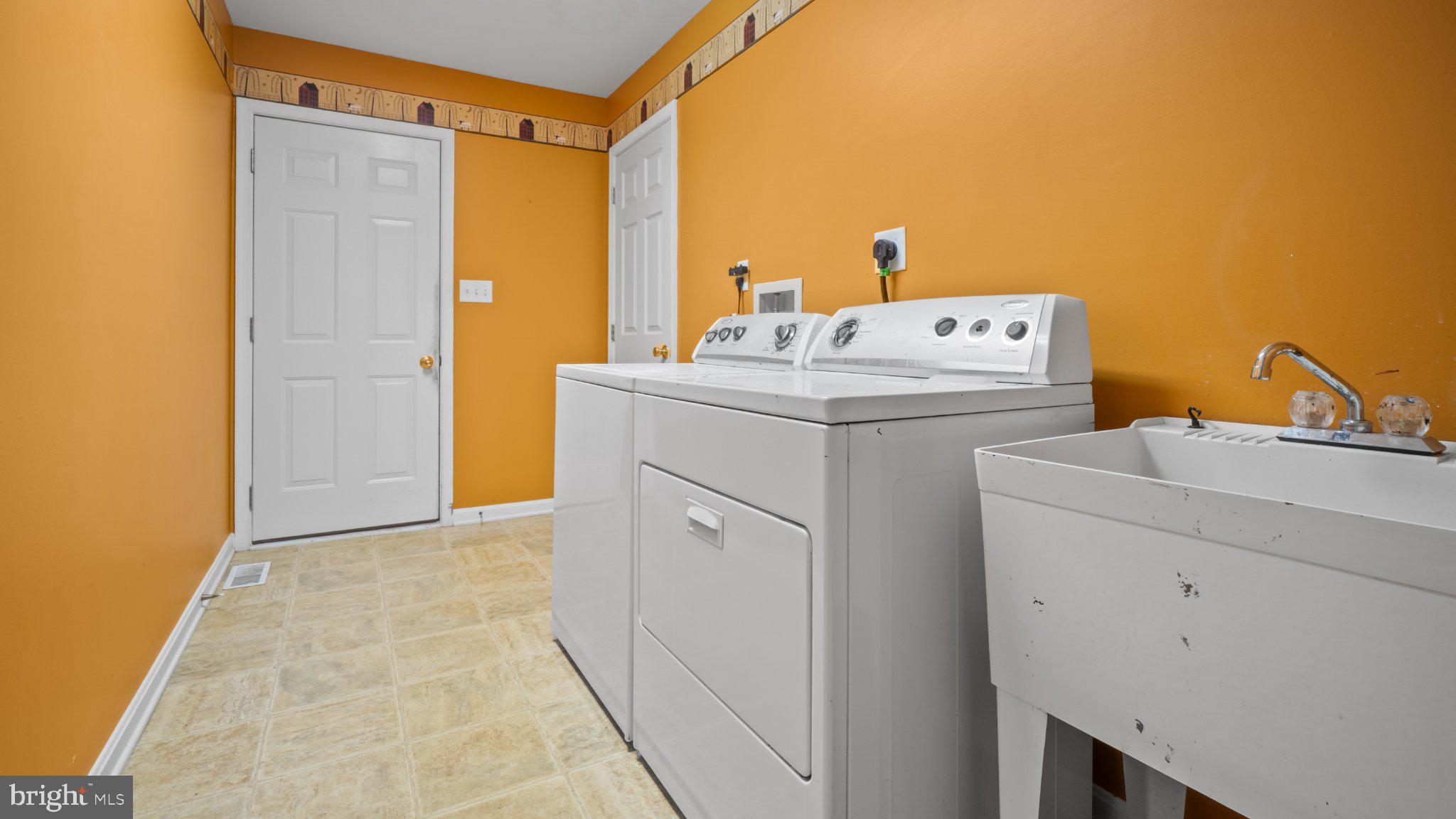 404 Michigan Drive Falling Waters, WV 25419 - Photo 20 of 28 Bright and cheerful laundry space.