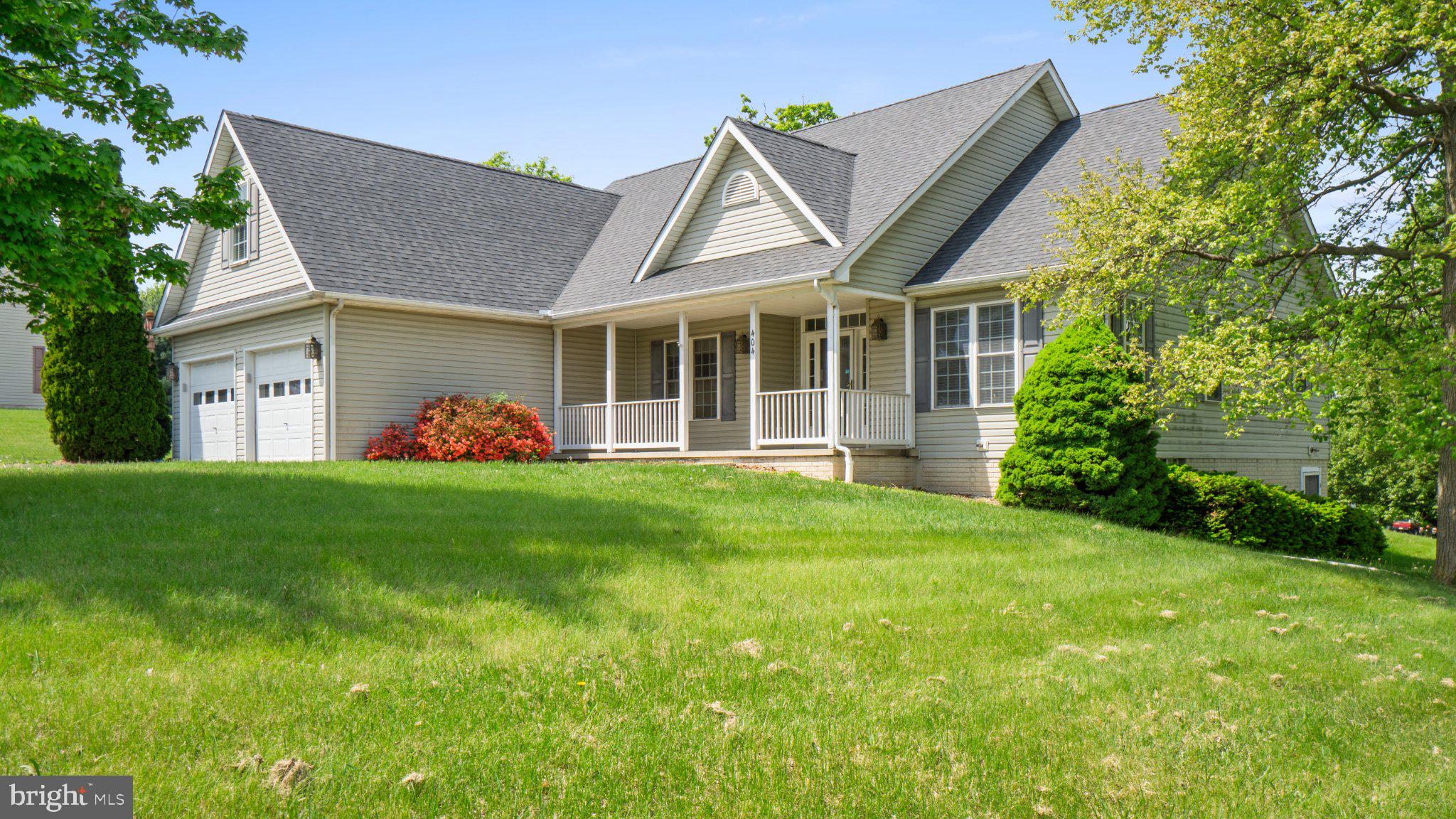 404 Michigan Drive Falling Waters, WV 25419 - Photo 2 of 28 Charming home with lush green lawn.