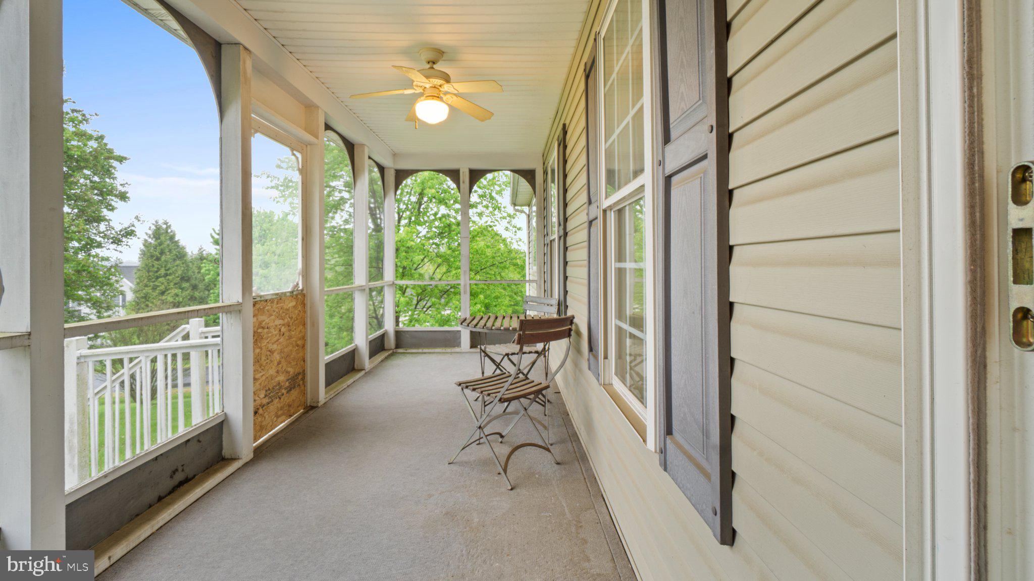 404 Michigan Drive Falling Waters, WV 25419 - Photo 21 of 28 Charming porch with serene views.