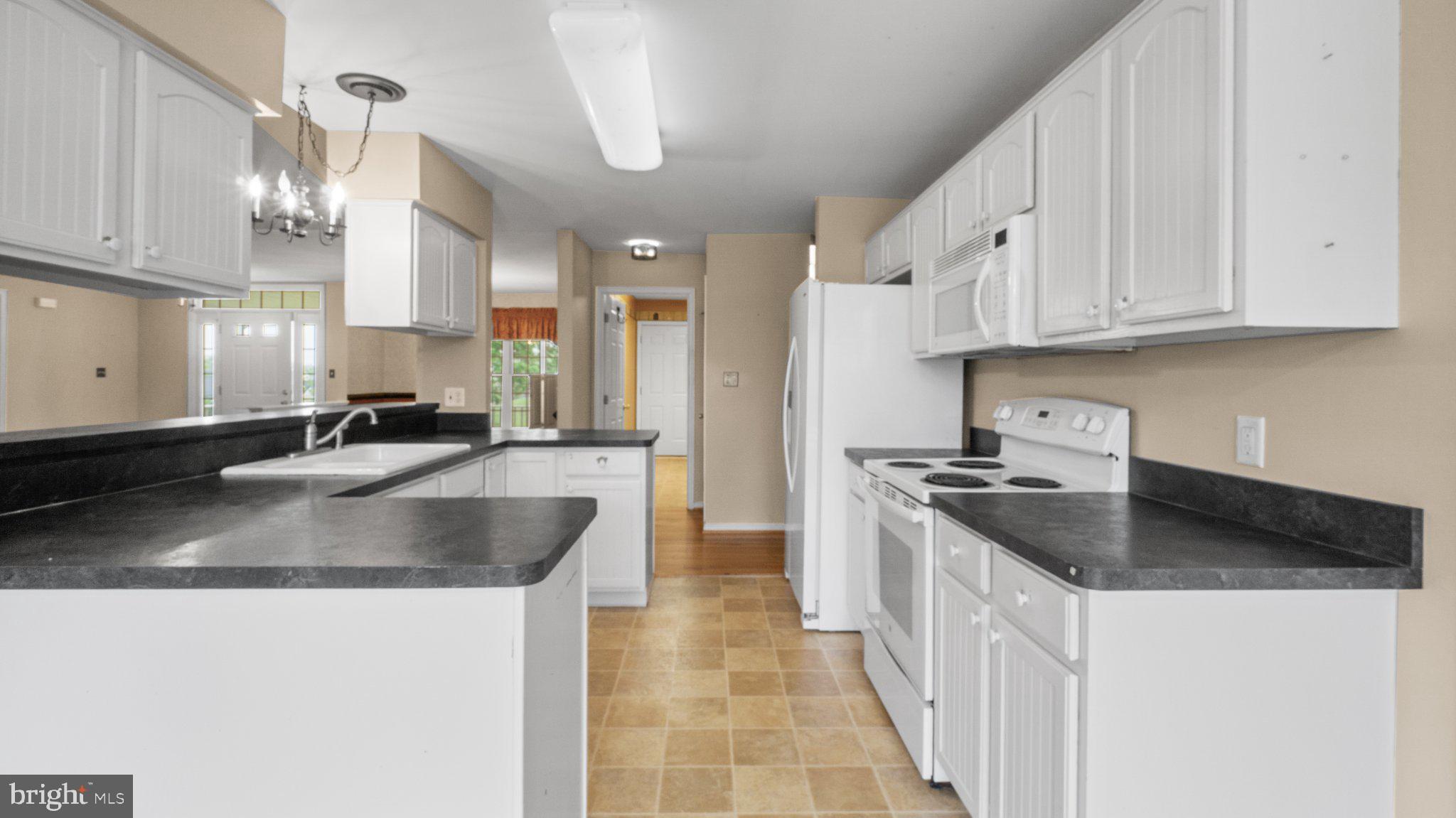 404 Michigan Drive Falling Waters, WV 25419 - Photo 7 of 28 Bright and spacious kitchen oasis.