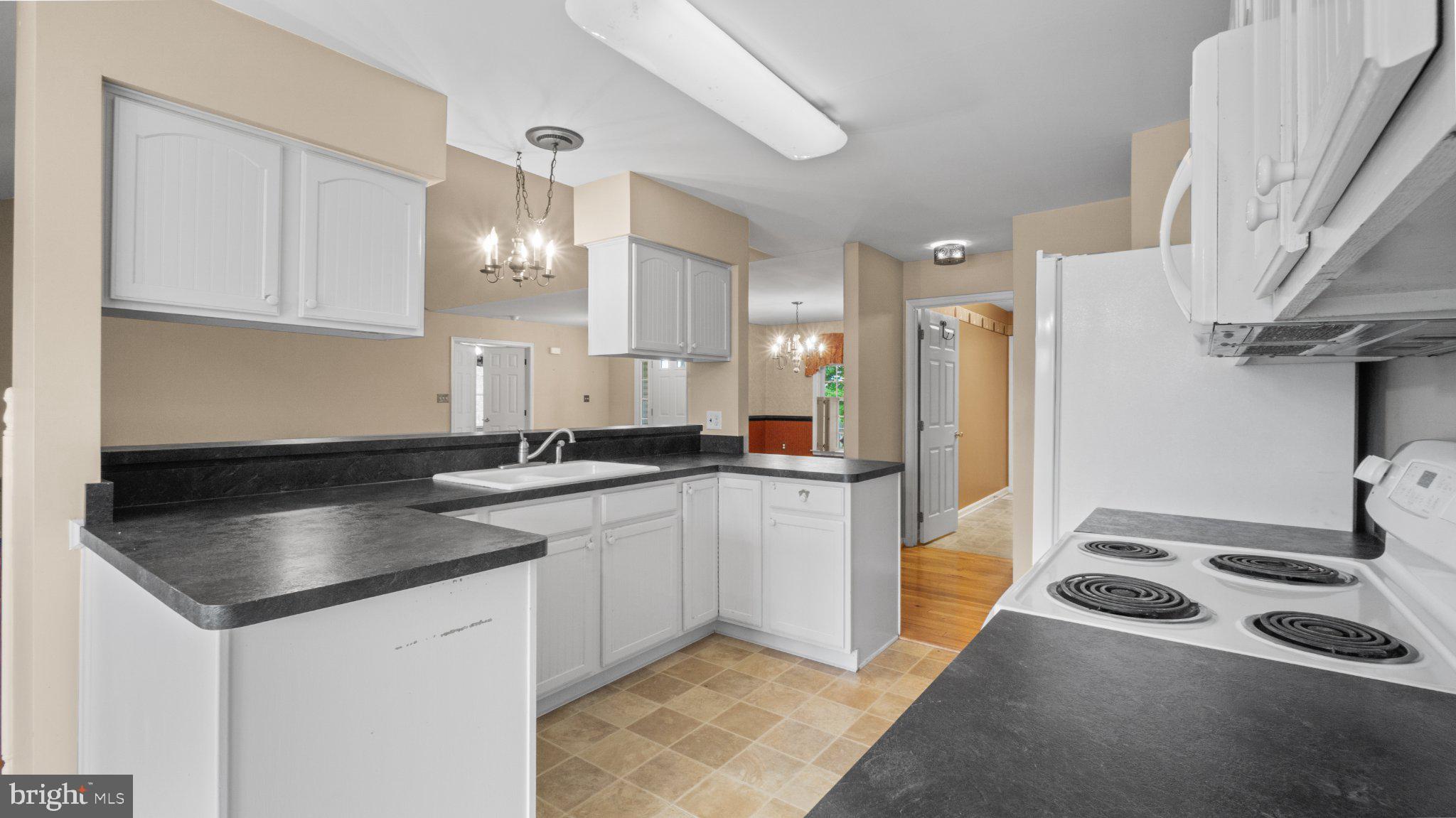 404 Michigan Drive Falling Waters, WV 25419 - Photo 8 of 28 Bright and inviting kitchen space.