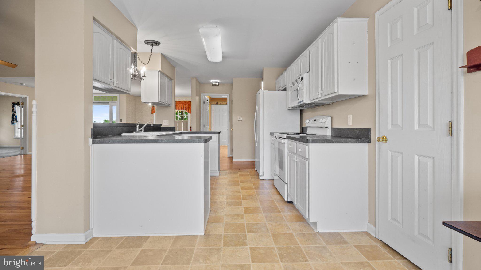 404 Michigan Drive Falling Waters, WV 25419 - Photo 9 of 28 Bright and spacious kitchen layout.