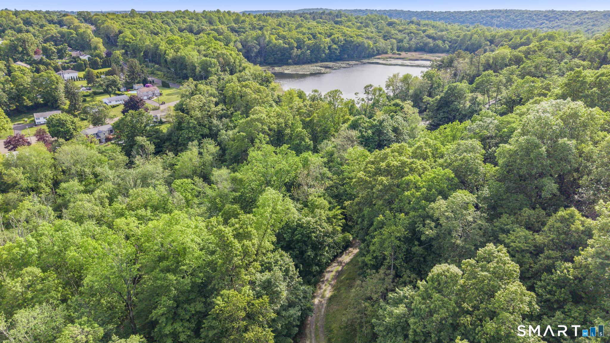 379 Brushy Plain Road Branford, CT 06405 - Photo 9 of 23 a view of a lake view with houses in the back