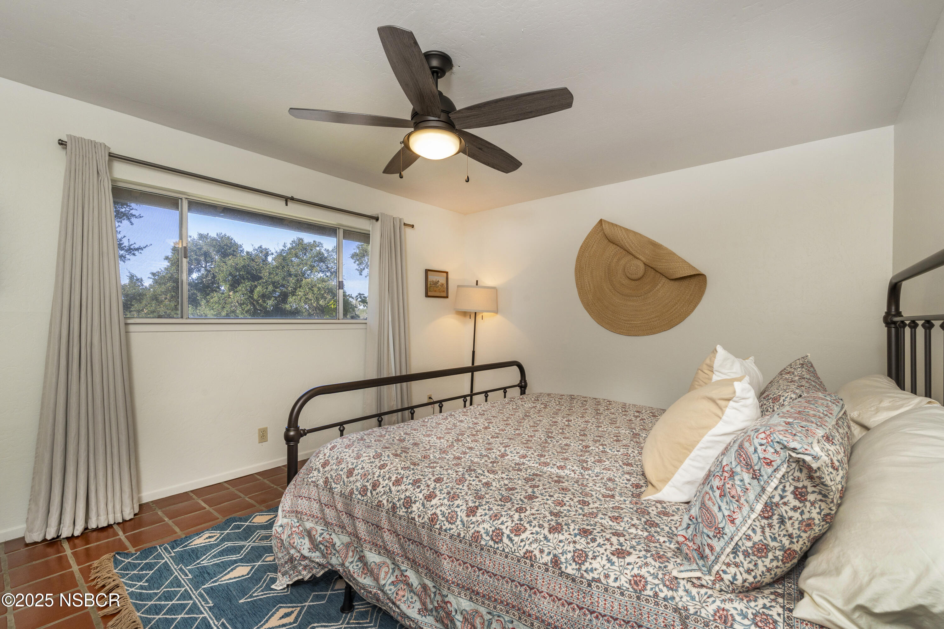 3776 Live Oak Road Santa Ynez, CA 93460 - Photo 19 of 46 a bedroom with a large bed and a window