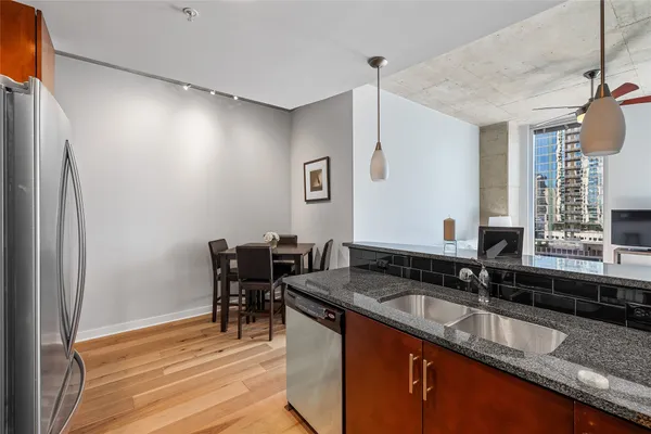a view of a dining room with furniture and wooden floor